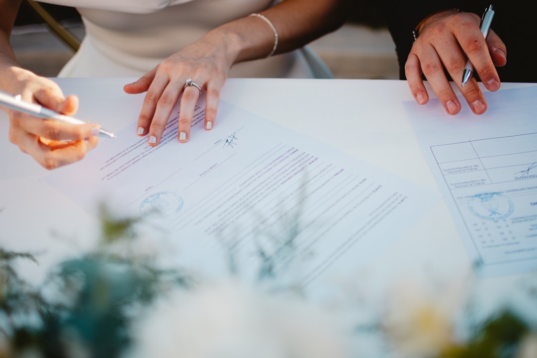 Smart Wedding Budget Allocation: How to Distribute Every Dollar With a Planner's Template 3 Couple reviewing wedding plans together at a table