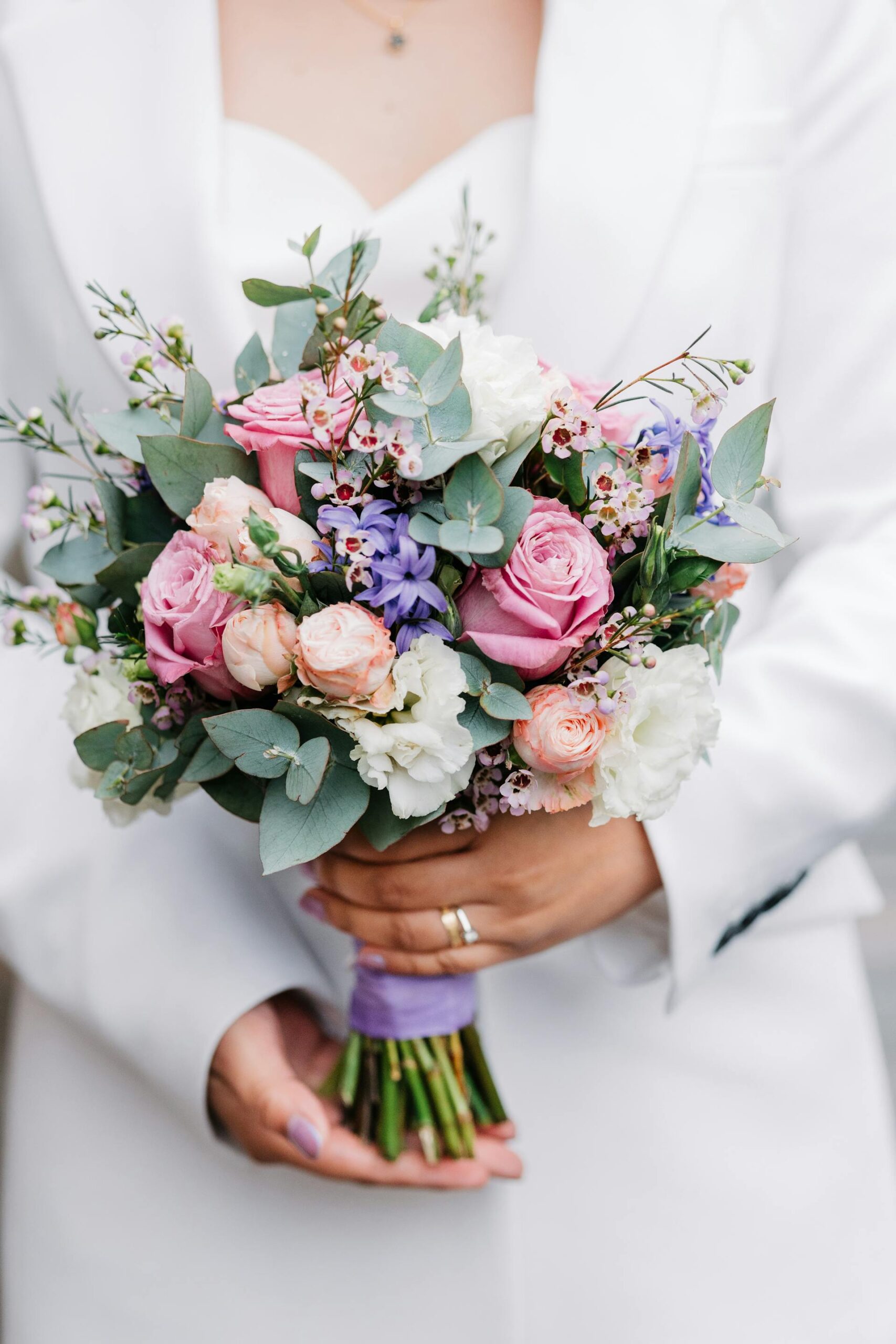 Romantic pastel bridal bouquet with garden roses and eucalyptus