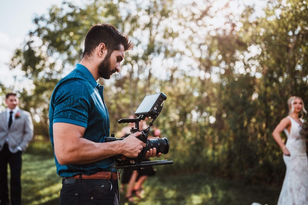 Wedding photography team capturing moments during ceremony