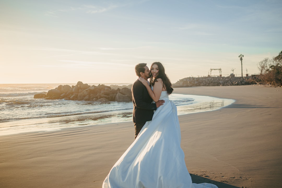 Romantic couple portrait at sunset during intimate wedding celebration