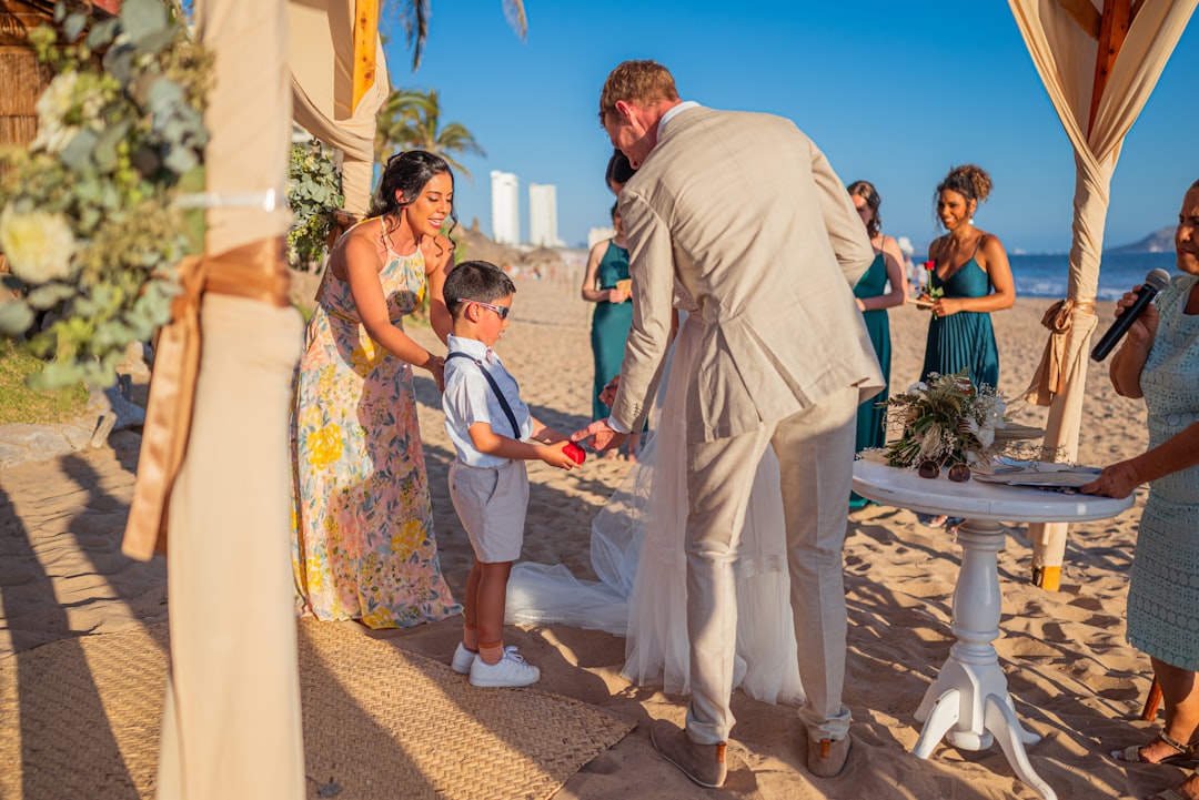 Wedding officiant speaking during beautiful ceremony with couple