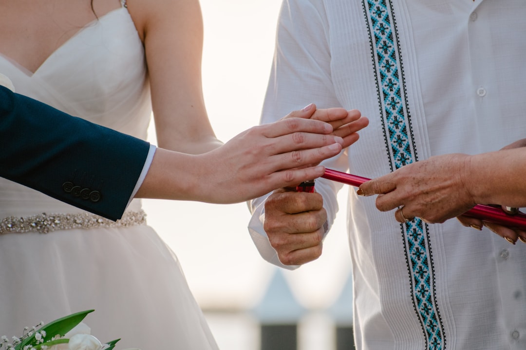 Wedding ceremony detail shot of ring exchange symbolic ritual moment